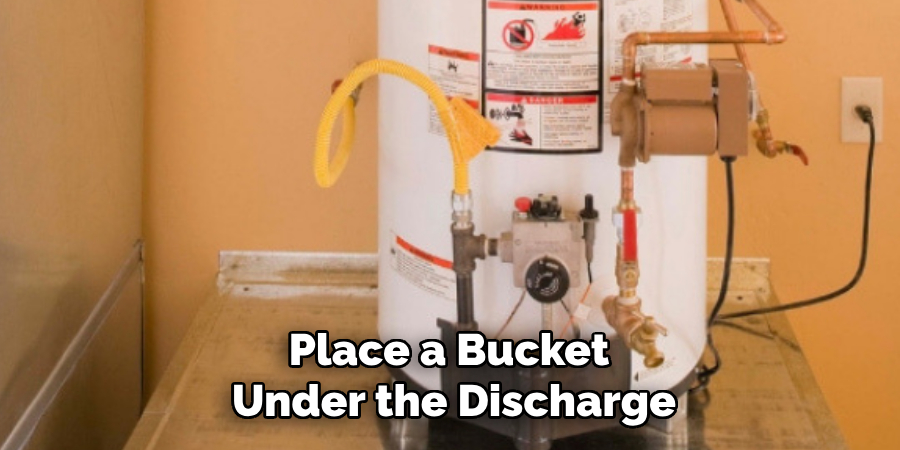 Place a Bucket 
Under the Discharge