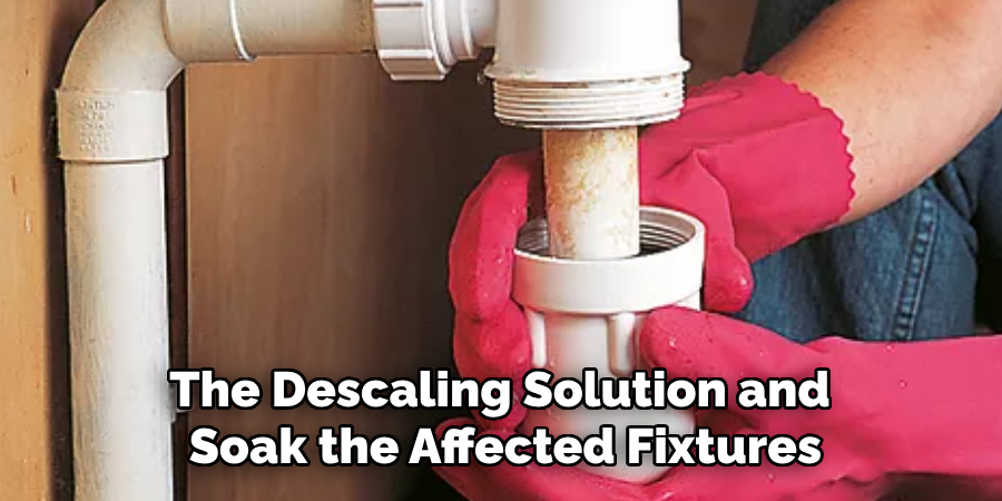 The Descaling Solution and 
Soak the Affected Fixtures