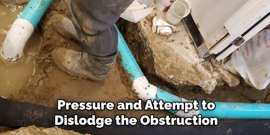 Pressure and Attempt to Dislodge the Obstruction