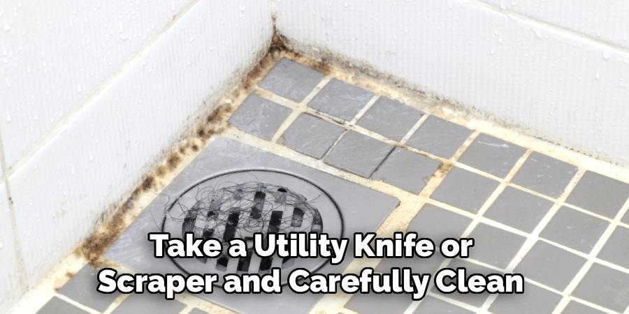 Take a Utility Knife or
Scraper and Carefully Clean